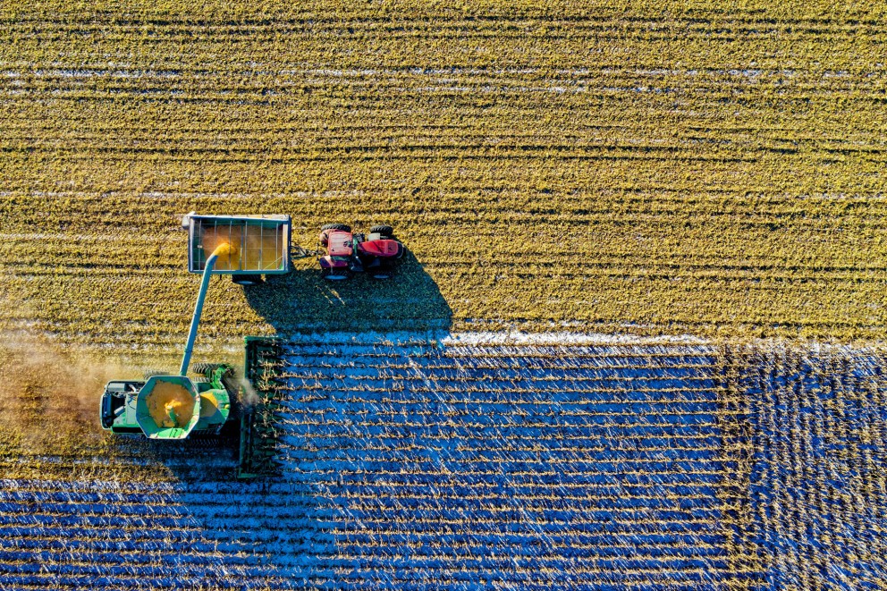 tractor harvesting field
