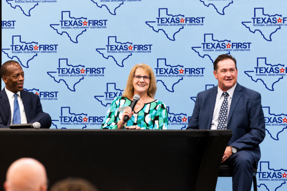 3 partners sitting at panel table