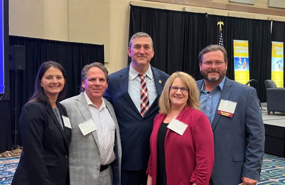 Partners posing at Moran Event